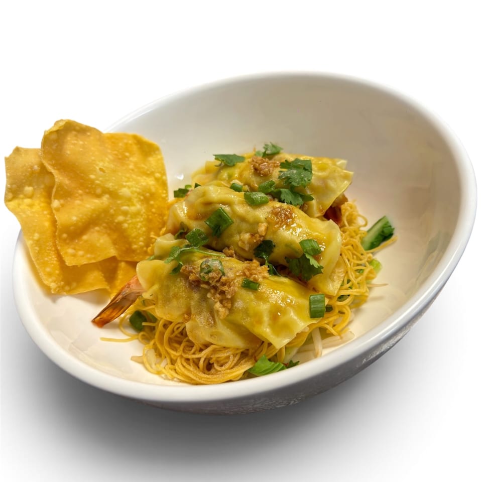 Wonton noodles with shrimp dumplings, garnished with green onions, cilantro, and crispy wonton skins.