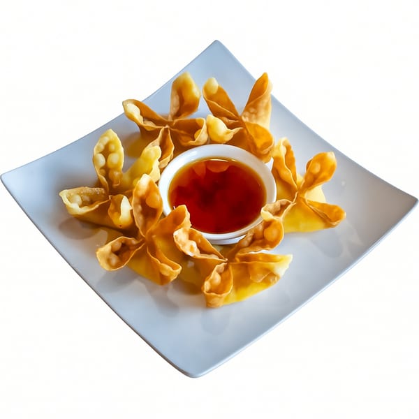 Crispy golden crab rangoons arranged around a small bowl of sweet chili dipping sauce on a white plate.
